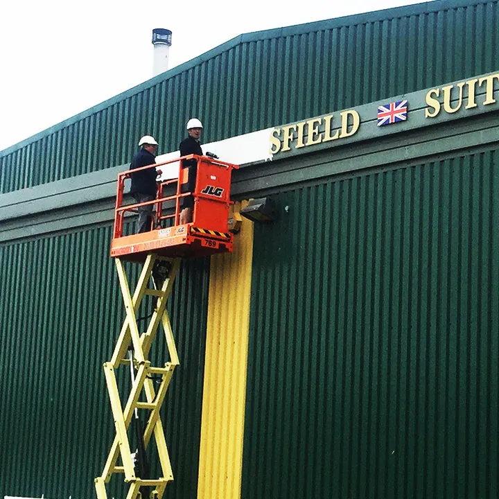Cherry picker high up signage ipaf trained scissor lift signmaker signlabs large sign su