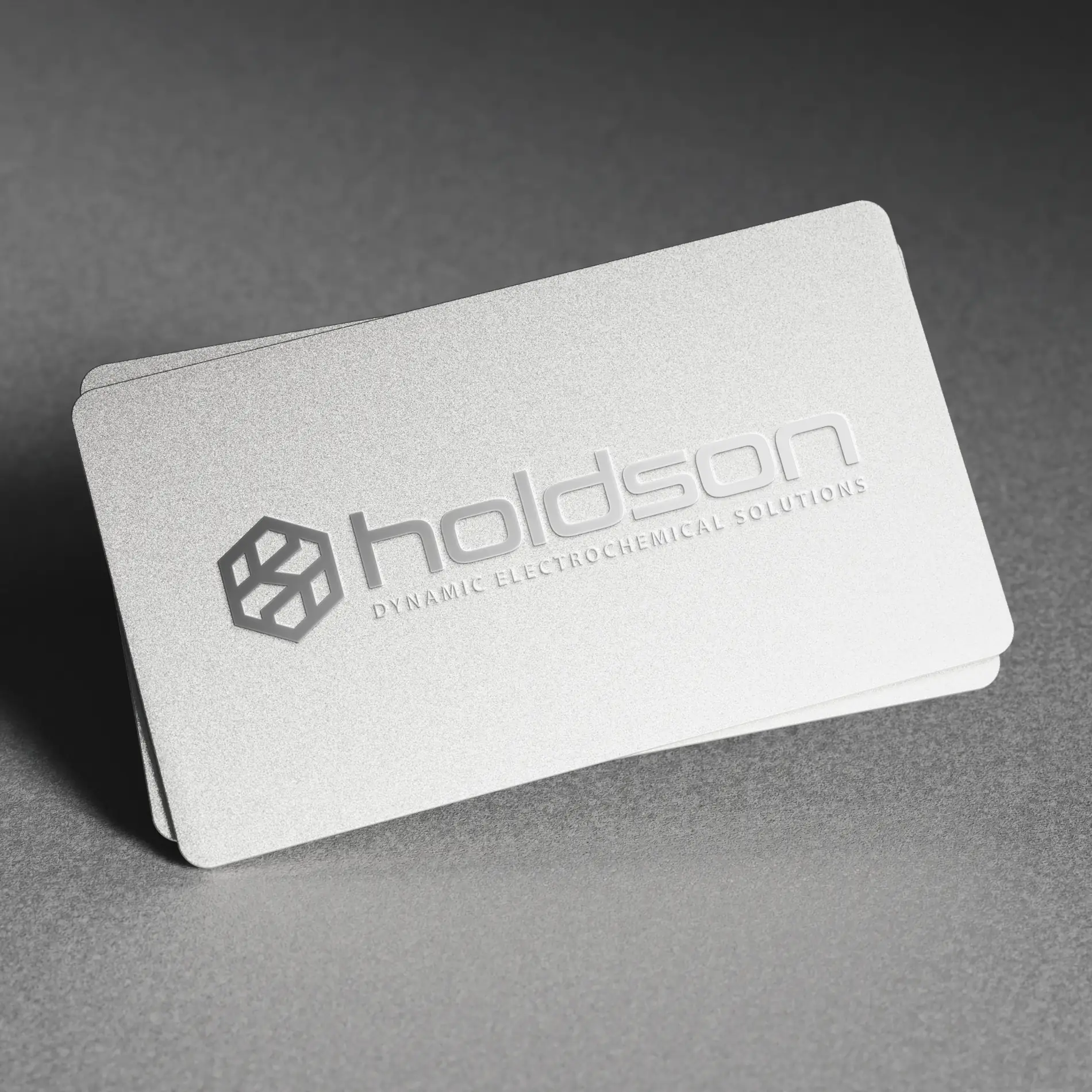 Metallic business card holdson marketing website build development design Mindlabs Media